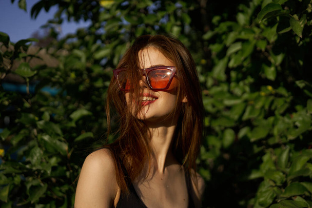pretty woman in swimsuit and sunglasses summer tropics - Фото, изображение