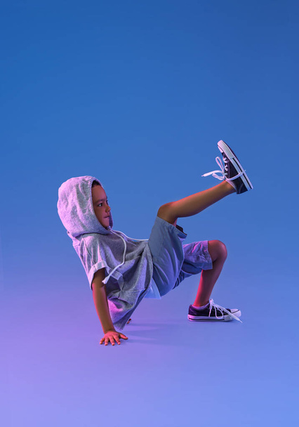 Cute dancing African-American boy on color background - Valokuva, kuva