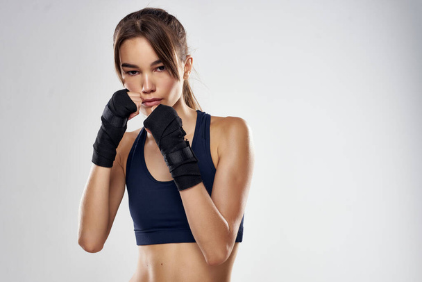 athletic woman boxing workout exercises fitness posing isolated background - Foto, imagen