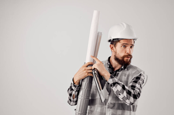 male builder with documents and drawings blueprints isolated background - Фото, зображення