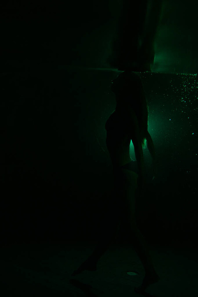 beautiful girl dancing underwater. high quality photo - Zdjęcie, obraz
