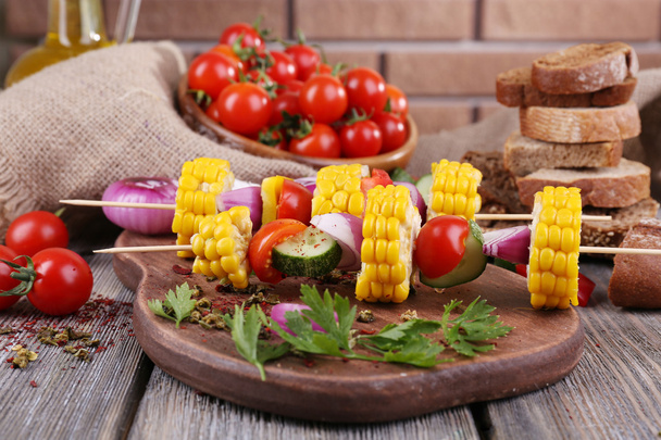 Sliced vegetables on picks on board on table close-up - Фото, зображення