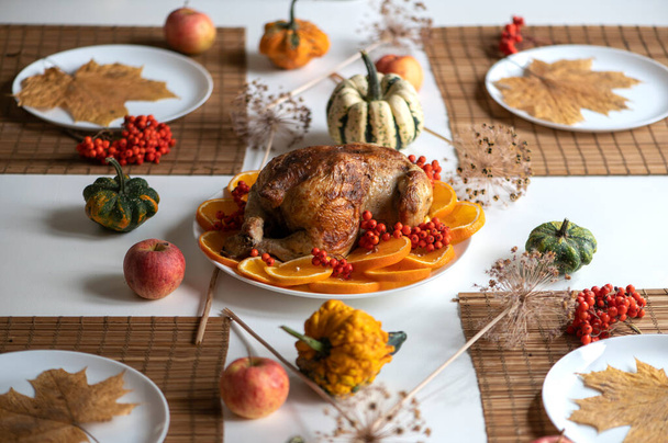 Traditional festive dinner with delicious roasted turkey served on table - 写真・画像