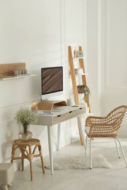 Comfortable workplace with modern computer and lamp in room. Interior design - Photo, Image