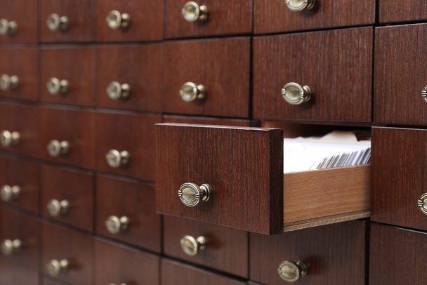 Open wooden drawer with index cards of library catalog - Fotoğraf, Görsel