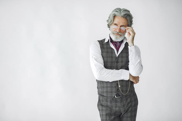 Handsome pensive mature businessman in formal suit - Фото, зображення