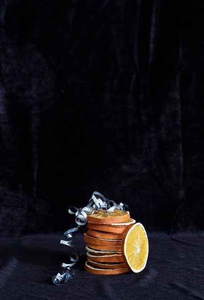 Dried orange slices on the dark background - Φωτογραφία, εικόνα