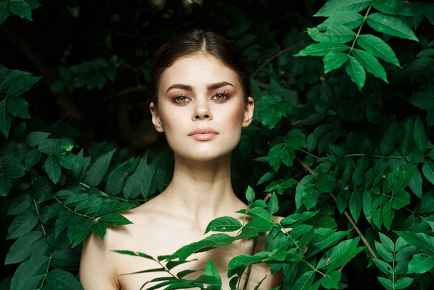 smiling woman skin care bare shoulders green leaves nature Lifestyle - Фото, зображення