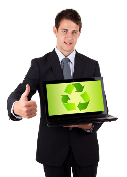 Young businessman holding laptop with recycle icon - Foto, Bild