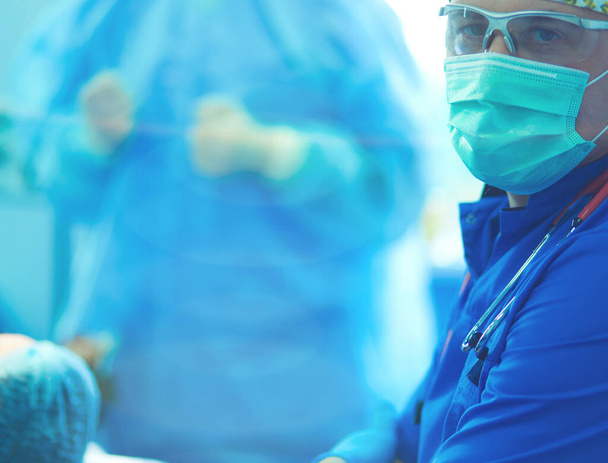 Male surgeon on background in operation room - Φωτογραφία, εικόνα