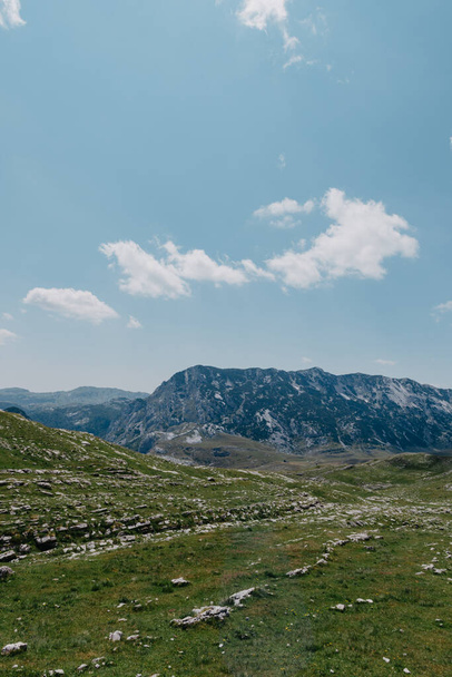 Amaizing view on Durmitor mountains, National Park, Mediterranean, Montenegro, Balkans, Europe. Bright summer view from Sedlo pass. The road near the house in the mountains. - Photo, Image