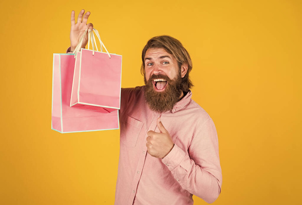 brutal bearded male man hold present or gift package, celebration - Photo, Image