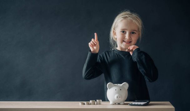 Smart child pretend to be businesswoman. Funny kid little girl playing at home. Education, start up and business idea concept - Photo, Image