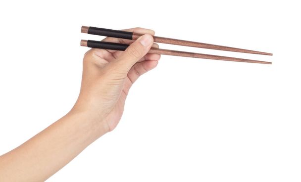 Hand holdig bambusové hůlky izolované na bílém pozadí. - Fotografie, Obrázek