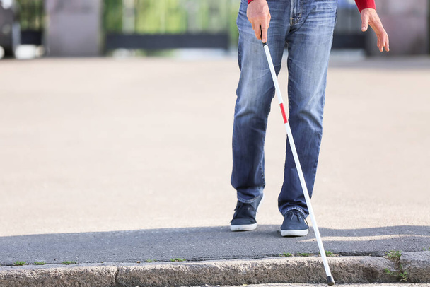 Blind senior man crossing road in city - Foto, imagen