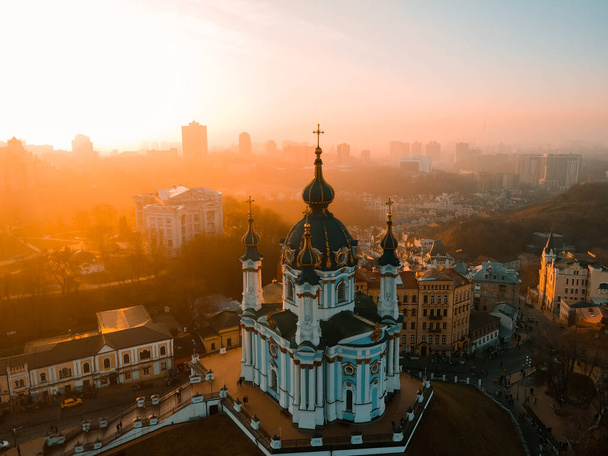 Aerial view from a drone of St. Andrew's Church in Kiev in autumn at sunset outdoor - Foto, Imagen