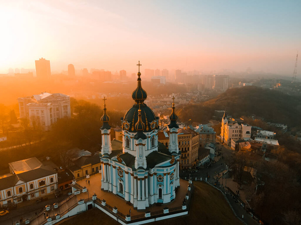 Aerial view from a drone of St. Andrew's Church in Kiev in autumn at sunset outdoor - Fotografie, Obrázek
