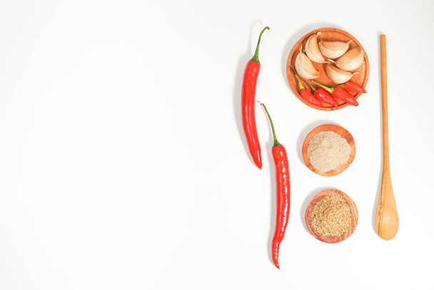 the variety of spices and herbs on a white background. a simple culinary background decorated with condiment recipes with copy space. suitable for social media post or website presentation. - Valokuva, kuva