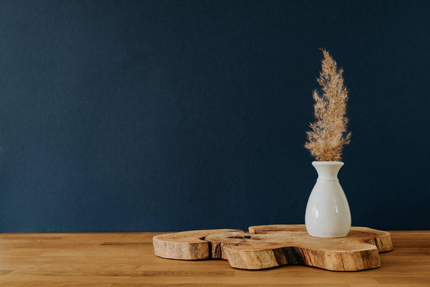 Grass in vase on wooden desk and copy space - Photo, Image