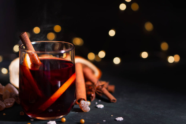 Gluhwein sweet hot warm Mulled red Wine or punch tea in mug cup glass spices citrus aromatic cinnamon star anise German tradition winter Christmas market beverage drink new year holidays festival - Фото, зображення