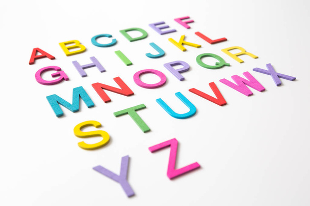 Colorful wooden english letters A-Z on white background and copy space for educational and graphic concept - Photo, Image