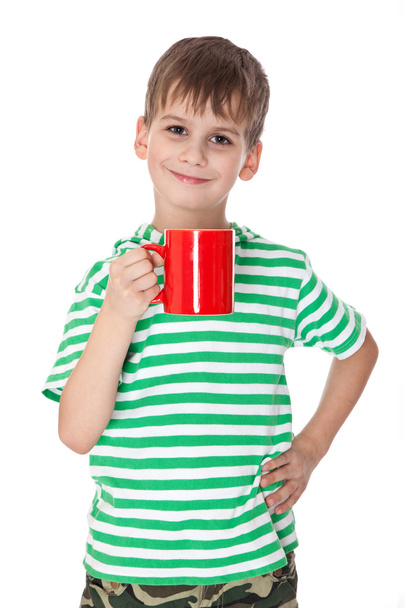 Boy holding a red cup - Foto, afbeelding