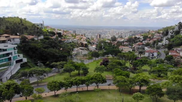 A Beautiful cityscape behind a park in Brazil - Aerial View - Video, Çekim
