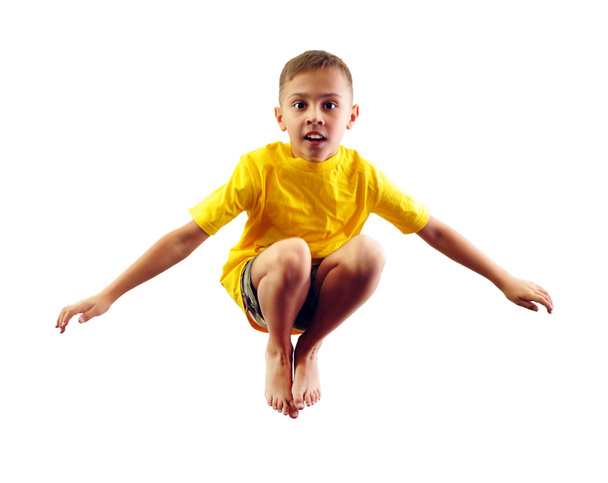 child exercising and jumping - Foto, afbeelding