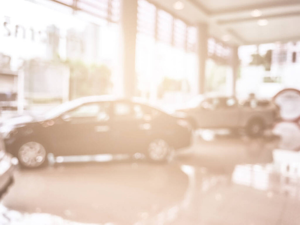 Blur image of car in the showroom use for background - Photo, Image