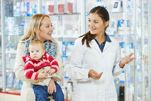 Pharmacy chemist, mother and child in drugstore - Фото, изображение