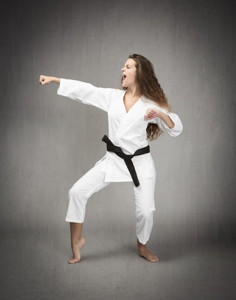 Judo girl hit in lateral view - Zdjęcie, obraz
