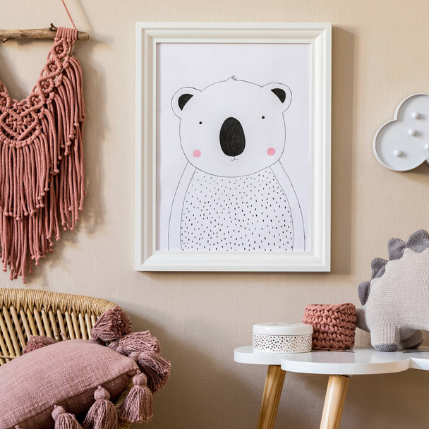 Stylish scandinavian nursery interior with mock up photo frame, toy, design furniture, pillows and accessories. Beautiful decoration on the beige background wall. Home decor for children room. - Foto, Imagem