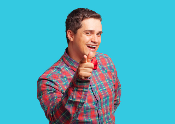 Casual man in shirt on blue background. - Foto, imagen