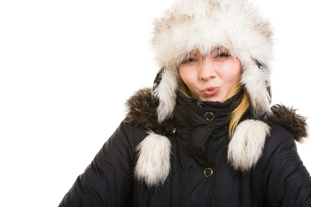 Winter vacation. Cheerful girl in warm clothes. - Фото, изображение