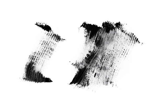 Black mascara brush strokes isolated on white background. - Photo, Image