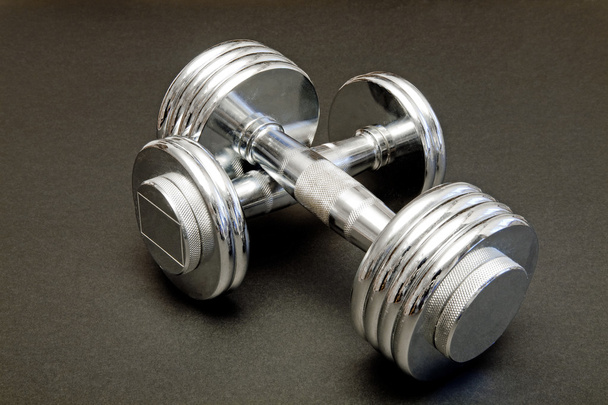 Barbell weights as a fitness tool ready for use - 写真・画像