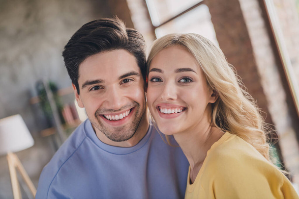 Portrait of attractive tender gentle cheerful couple spending free time weekend at home loft industrial interior indoors - Photo, image