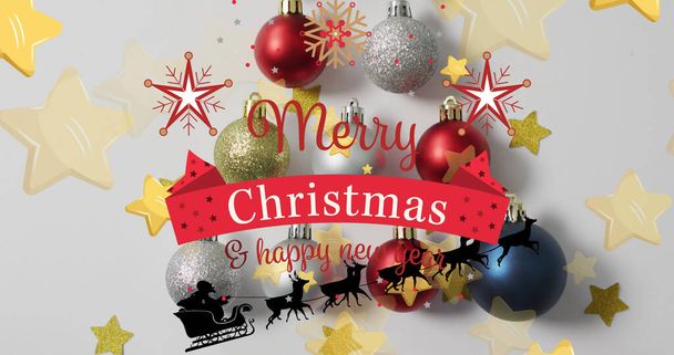 Image of merry christmas and decorations over white background with baubles and starts. christmas, tradition and celebration concept digitally generated image. - Foto, Imagem