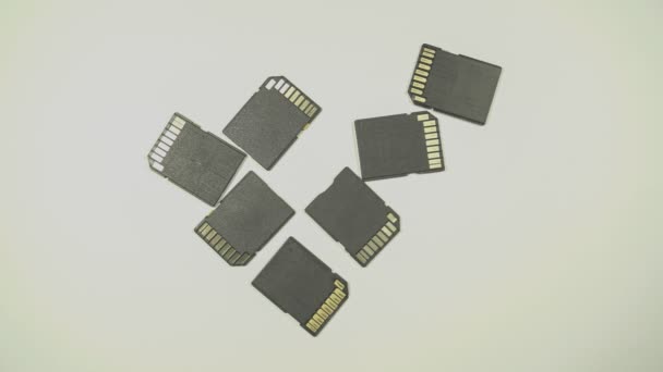 Clips video 4k and full HD of memory SD card isolated on clean background this sd card for various computer, digital camera and sm - Filmati, video