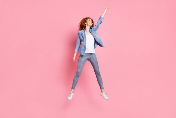 Full body photo of happy nice strong young woman look catch umbrella empty space isolated on pink color background - Zdjęcie, obraz