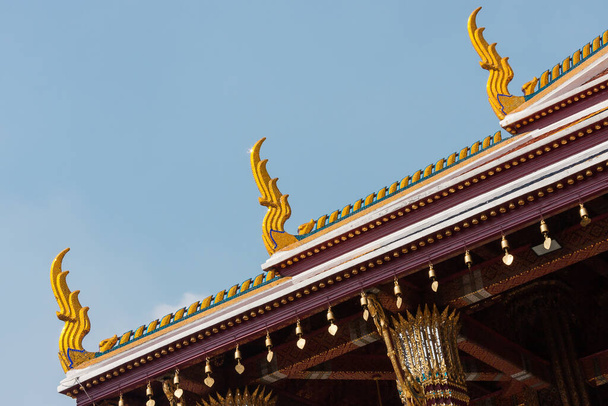 Fragment of the wooden roof with patterns of Grand Palace, Bangkok, Thailand. - Фото, зображення