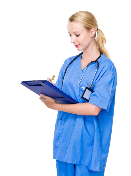 Doctor write on clipboard - Photo, image