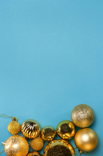 golden christmas decorations on a blue background. - Photo, Image