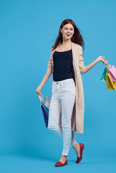 beautiful woman with packages in hands Shopaholic isolated background - Fotó, kép