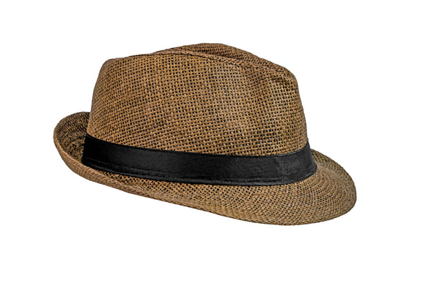 Brown straw hat isolated on a white background. Elegant broad-brim hat with black ribbon, side view - Photo, Image