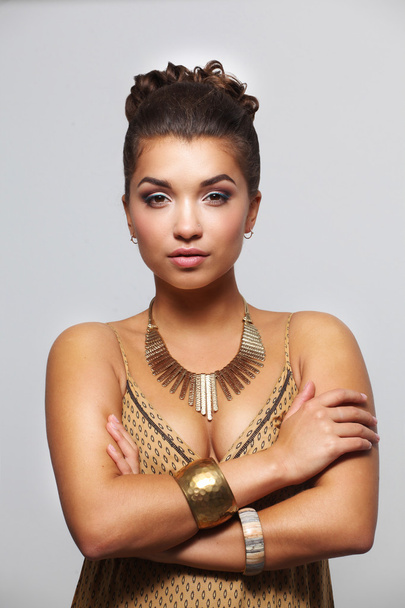 Young beautiful brunette woman with beads - Foto, immagini