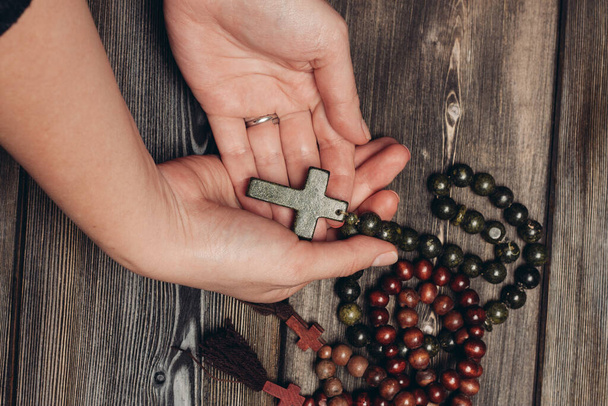 beads with orthodox cross wooden background catholicism christianity - 写真・画像
