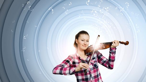 Young woman playing violin - Фото, зображення
