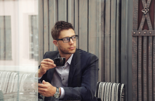 young attractive businessman drinking espresso coffee in the cit - Foto, Imagen