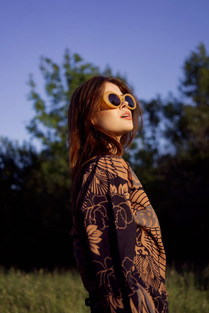 pretty woman in fashionable clothes sunglasses nature posing - 写真・画像